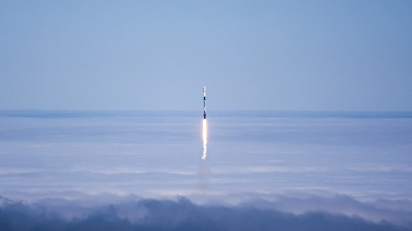 A SpaceX Falcon 9 rocket lifting off from Vandenberg Space Force Base. A planned Monday launch was shifted to Tuesday, and could be postponed again.